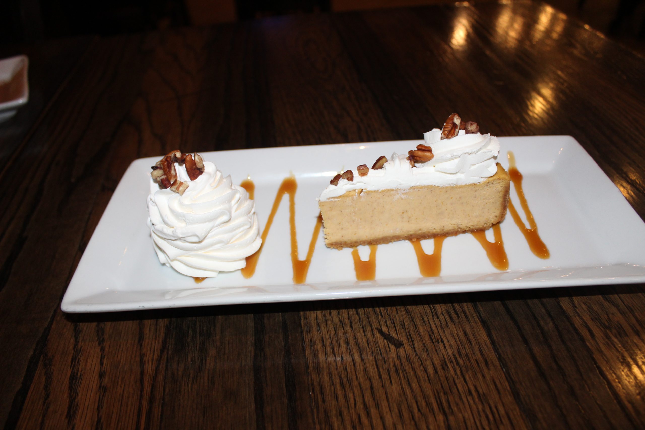 Pumpkin Cheesecake: Pumpkin Cheesecake with butter graham cracker crust topped with whipped cream and caramel sauce $7.99  